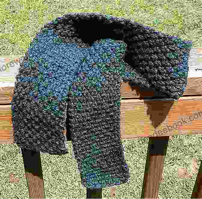 A Photo Of A Moss Stitch Scarf Just Stitches: 70 Knitting Stitch Patterns To Inspire Your Next Project (Tiger Road Crafts)